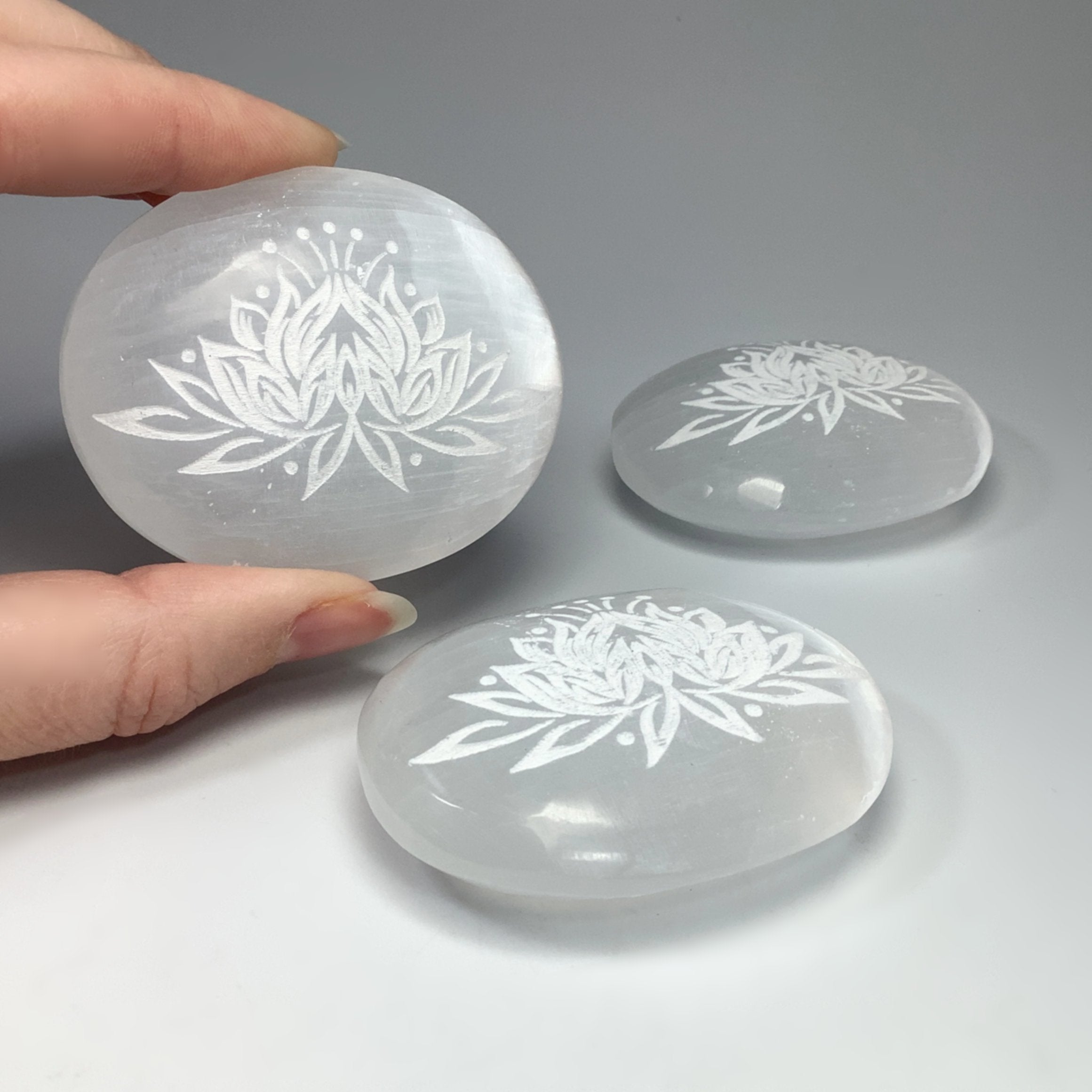 Selenite Palm Stone with Lotus Flower Engraving – Rocks and Gems