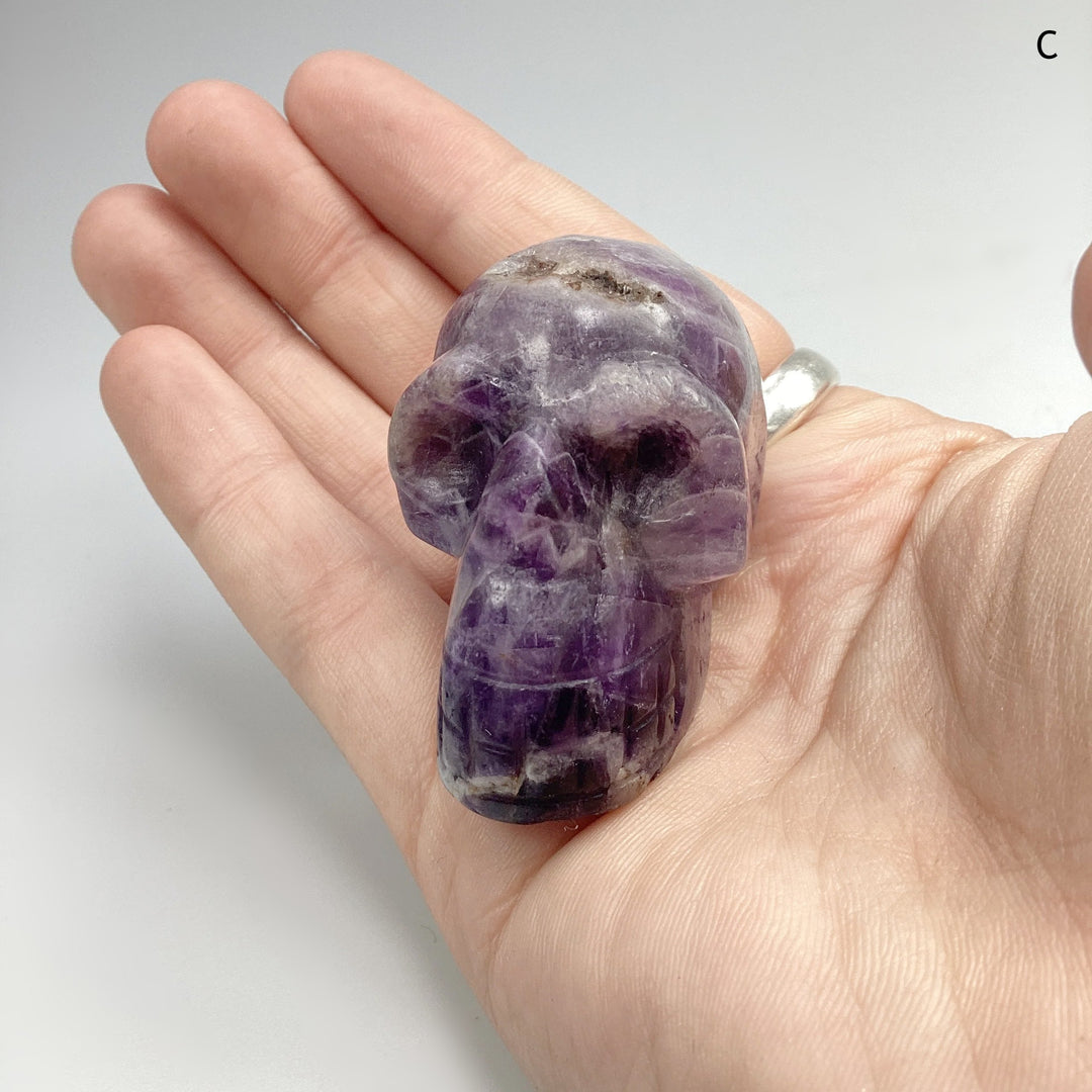 Carved Chevron Amethyst Skull at $69 Each