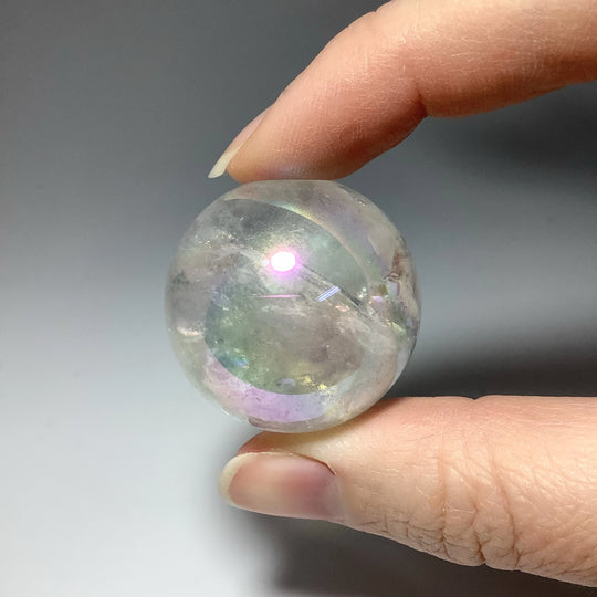 Opalescent Aura Quartz Sphere at $69 Each